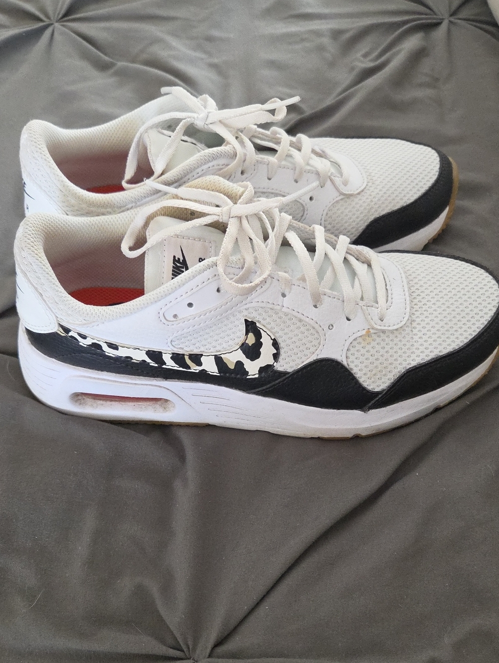 Nike Women’s White & Black Sneakers with Animal-Print Swoosh
